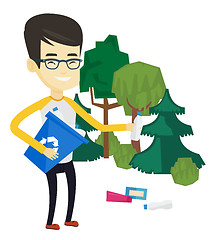Image showing Man collecting garbage in forest.