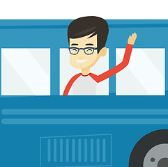 Image showing Man waving hand from bus window.