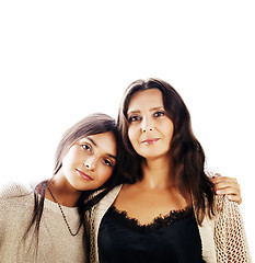 Image showing cute pretty teen daughter with mature mother hugging, fashion st