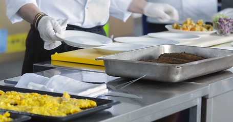 Image showing Preparing meat on the table