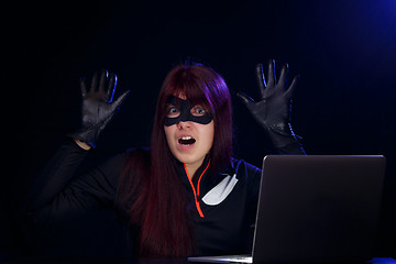 Image showing Brunette spy in black mask