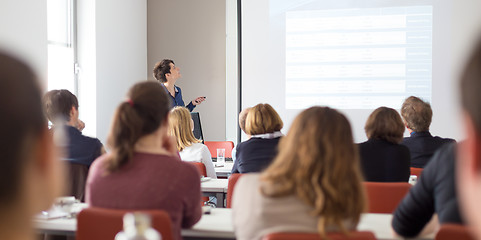 Image showing Woman giving presentation in lecture hall at university.