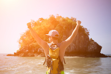 Image showing Young guy with arms raised