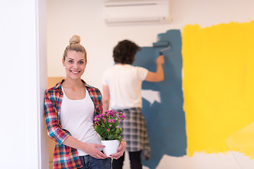 Image showing happy young couple doing home renovations