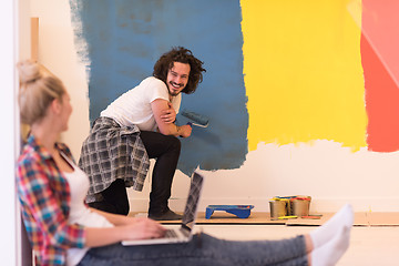 Image showing Happy couple doing home renovations