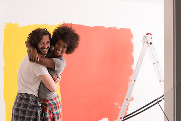 Image showing Young happy multiethnic couple hugging