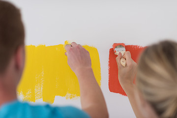 Image showing couple painting interior wall