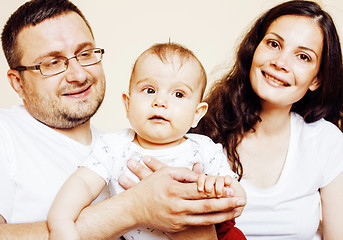 Image showing young happy modern family smiling together at home. lifestyle real people concept, father holding baby son