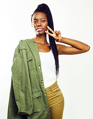 Image showing young pretty african-american girl posing cheerful emotional on white background isolated, lifestyle people concept