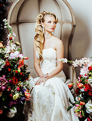 Image showing beauty emotional blond bride in luxury interior dreaming, crazy complicate hairstyle