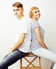 Image showing young pretty teenage couple, hipster guy with his girlfriend happy smiling and hugging isolated on white background, lifestyle people concept 