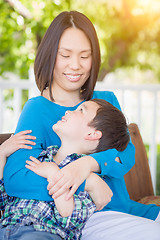 Image showing Outdoor Portrait of Chinese Mother with Her Mixed Race Chinese a