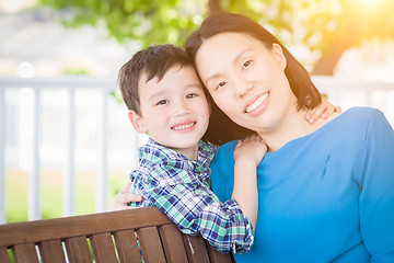 Image showing Outdoor Portrait of Chinese Mother with Her Mixed Race Chinese a