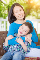 Image showing Outdoor Portrait of Chinese Mother with Her Mixed Race Chinese a