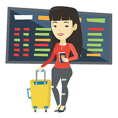 Image showing Woman with suitcase and ticket at the airport.