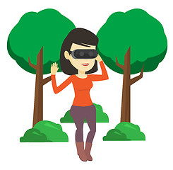 Image showing Woman wearing virtual reality headset in the park.