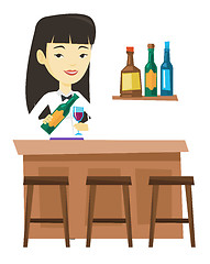 Image showing Bartender standing at the bar counter.