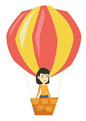 Image showing Asian woman flying in hot air balloon.