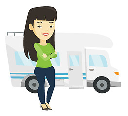 Image showing Woman standing in front of motor home.