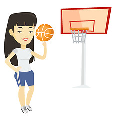 Image showing Young basketball player spinning ball.