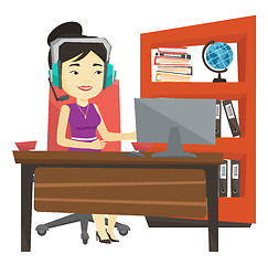 Image showing Business woman with headset working at office.
