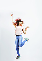 Image showing young pretty jumping mulatto woman posing cheerful emotional isolated on white background, lifestyle people concept 