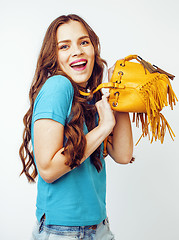 Image showing young pretty long hair woman happy smiling isolated on white background, wearing cute tiny fashion handbag, lifestyle people concept