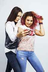 Image showing lifestyle people concept: two pretty stylish modern hipster teen girl having fun together, diverse nation mixed races, happy smiling making selfie 