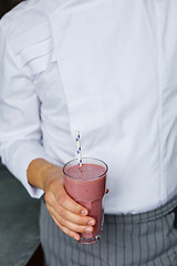 Image showing Faceless shot of man with smoothie