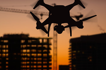 Image showing Silhouette of Unmanned Aircraft System (UAV) Quadcopter Drone In