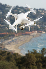 Image showing Unmanned Aircraft System (UAV) Quadcopter Drone In The Air Over 