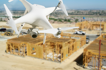 Image showing Unmanned Aircraft System (UAV) Quadcopter Drone In The Air Over 