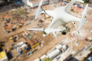 Image showing Unmanned Aircraft System (UAV) Quadcopter Drone In The Air Over 