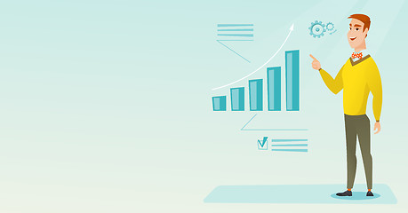 Image showing Successful businessman pointing at chart going up.