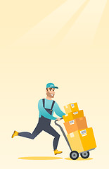 Image showing Delivery postman with cardboard boxes on trolley.