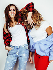 Image showing lifestyle people concept: two pretty stylish modern hipster teen girl having fun together, happy smiling making selfie