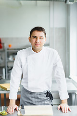 Image showing Young smiling male chef posing