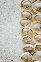 Image showing Rows of freshly made meat pockets