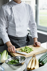 Image showing Crop shot of chef making vegetable smoothie