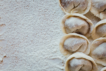 Image showing Rows of freshly made meat pockets