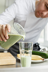 Image showing Male cooking fresh vegetable smoothie