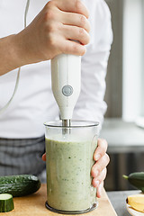 Image showing Male chef blending smoothie