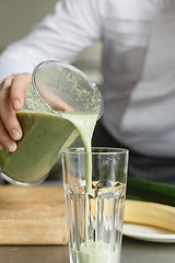 Image showing Male cooking fresh vegetable smoothie