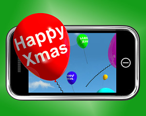 Image showing Balloons Floating From Mobile Phone With Happy Xmas