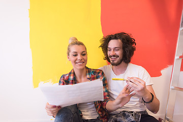 Image showing Happy young couple relaxing after painting