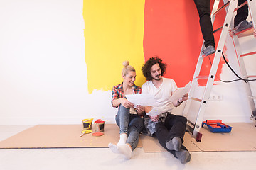 Image showing Happy young couple relaxing after painting