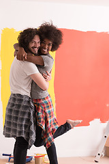 Image showing Young happy multiethnic couple hugging