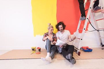 Image showing Happy young couple relaxing after painting