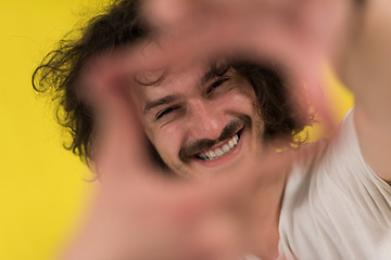 Image showing young man with funny hair over color background