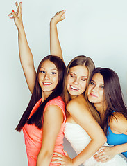 Image showing group of many cool modern girls friends in bright clothers together having fun isolated on white background, happy smiling lifestyle people concept